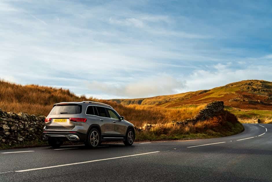 UK hire car - sporty SUV on winding countryside road