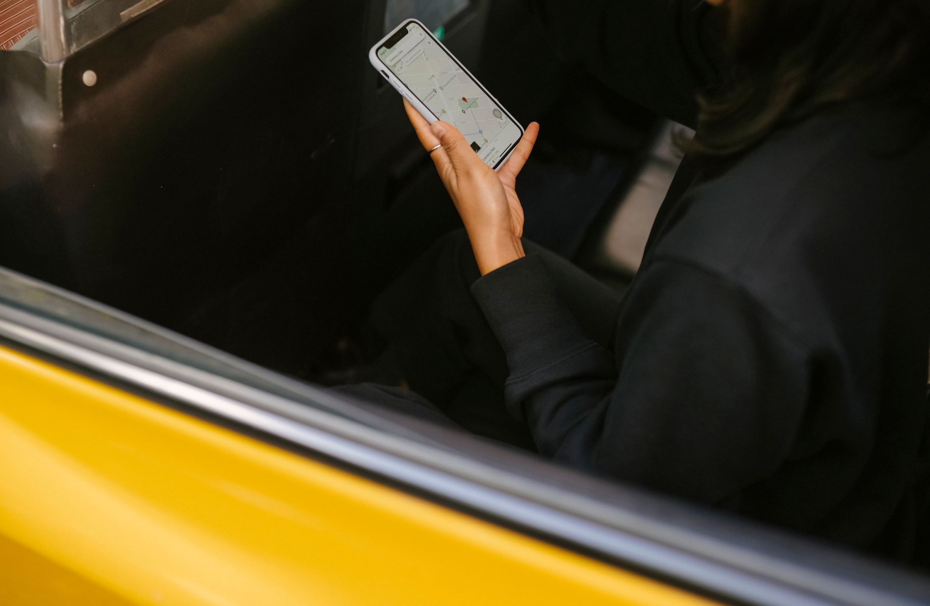 Person filling in an online travel application on a smartphone, similar to the UK ETA form for carnival visitors