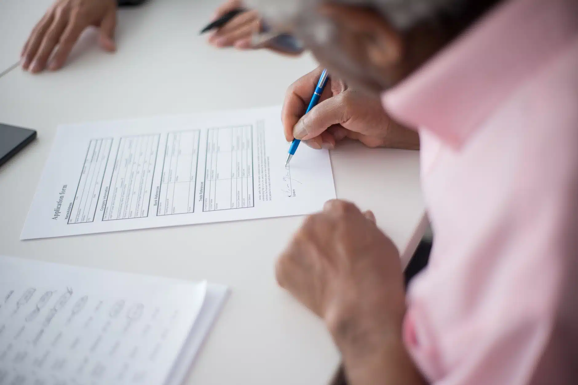 Person completing the UK ETA travel authorisation form on a smartphone app