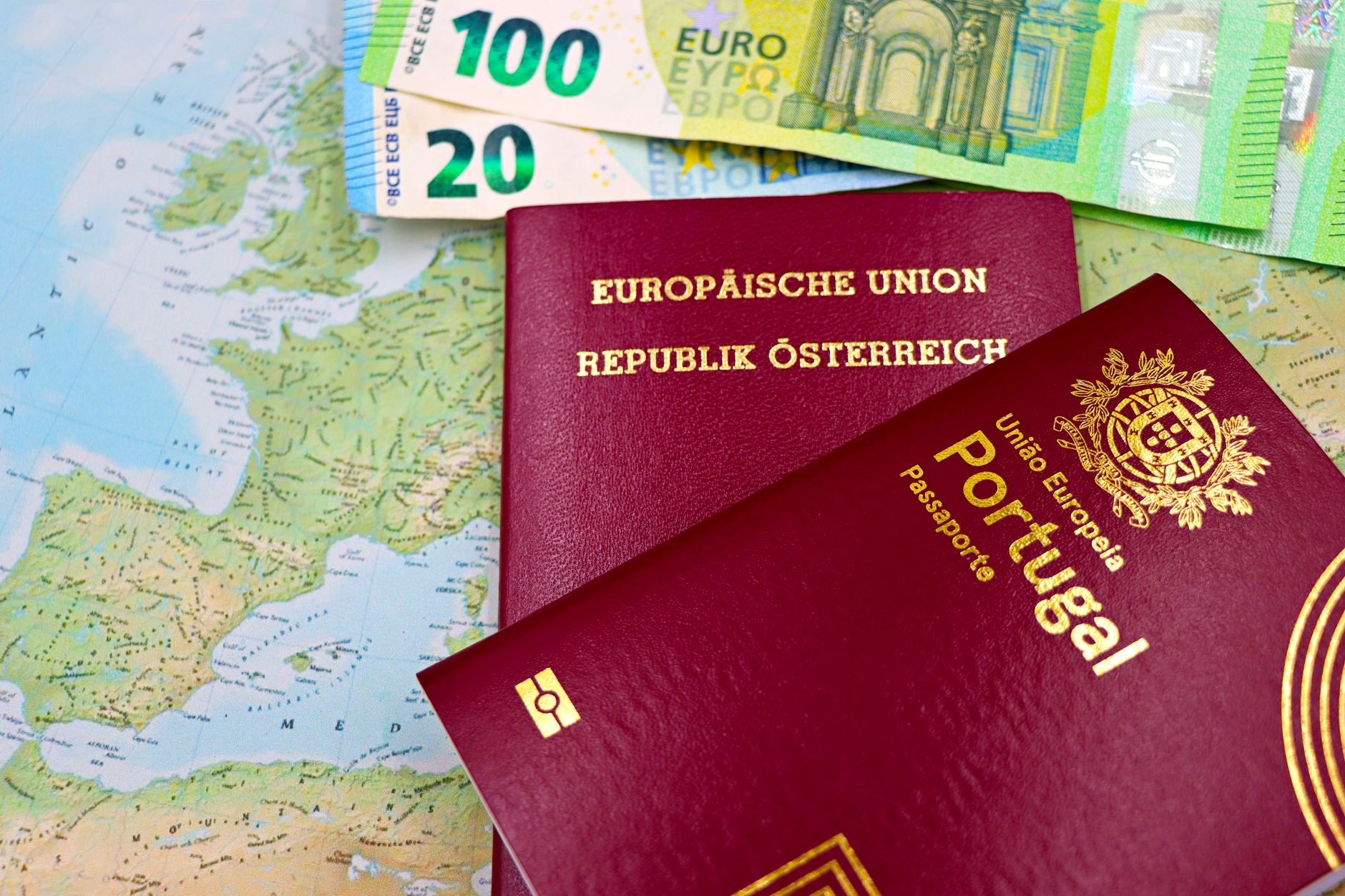 Older couple checking passports and travel documents at their kitchen table