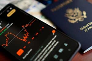 A helper completing a UK ETA application for another traveller on a smartphone