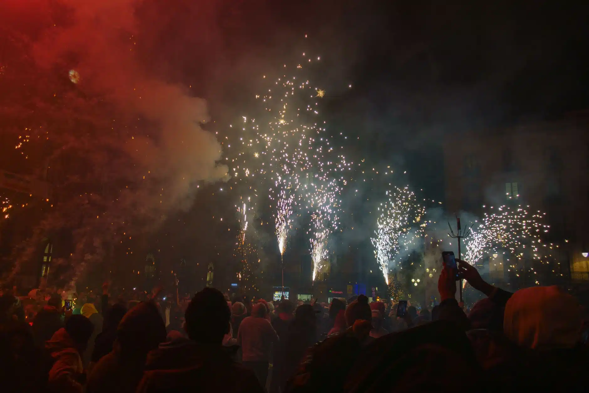 Crowd celebrating New Year in a UK city centre at night