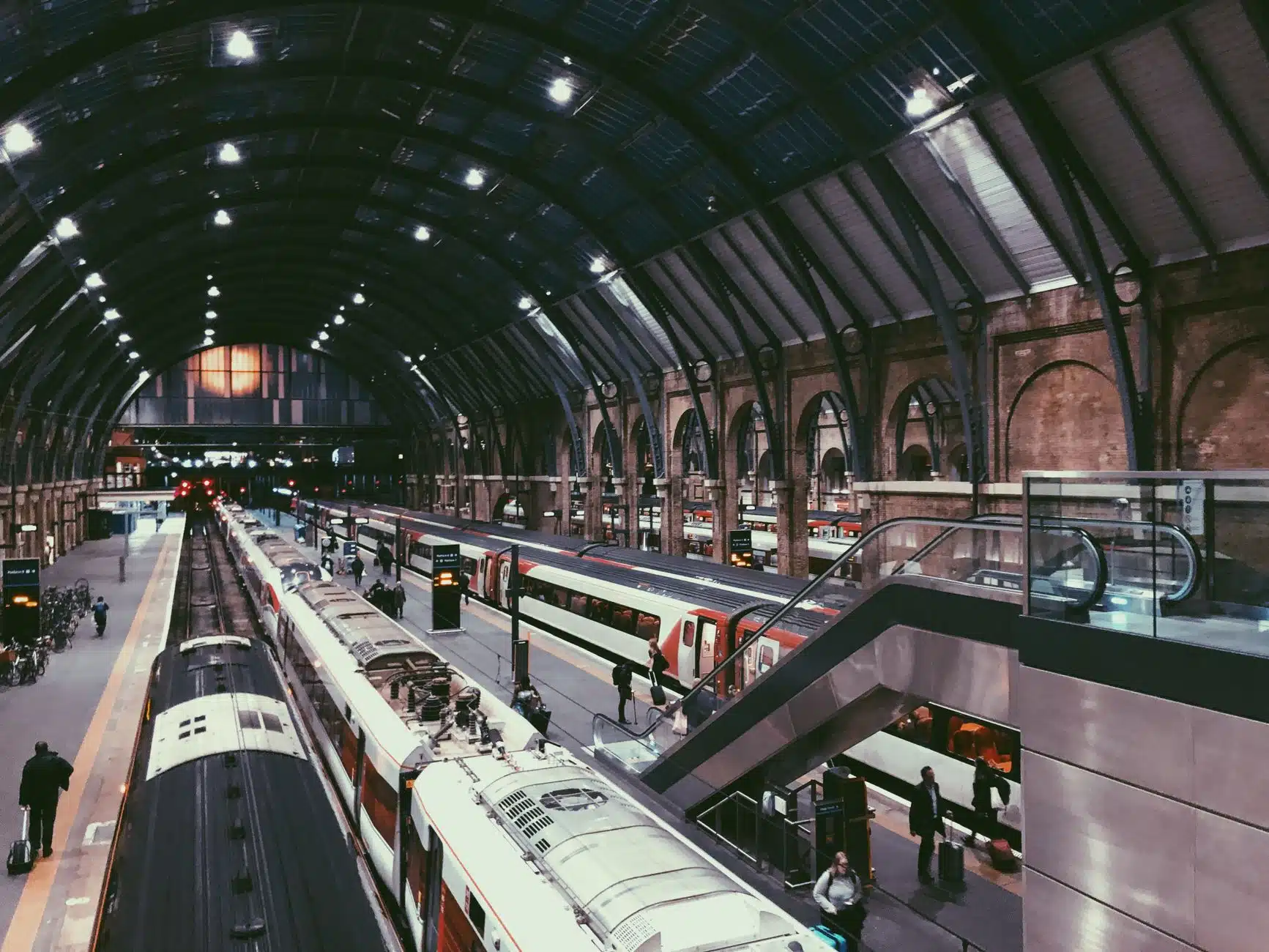 Passengers at a London train station late at night after New Year events