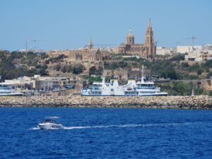 Ferry approaching an island harbour, with a UK ETA needed to visit